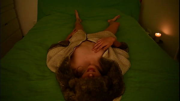 Young amateur teen masturbating and moaning on the bed wearing fur coat