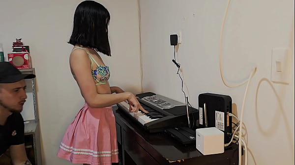 Sexy and hot Laura in skirt wants to learn to play the piano.
